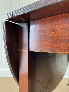 A Large English Georgian Country Mahogany Drop Leaf Table on Castors c1800
