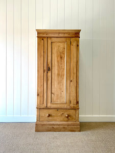 A Handsome English 19th Pine Cupboard with Dark Wooden Knobs