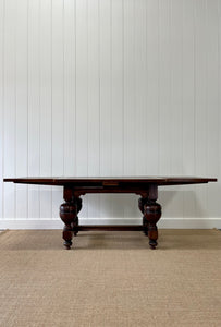 An English Country Oak Cup and Cover Draw Leaf Dining Table c1890