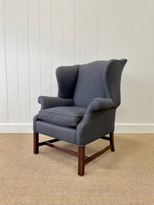 An Antique English Mahogany Wing Back Chair