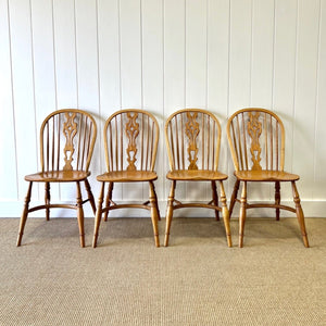 A Set of Four Ash Crinoline Stretcher Windsor Chairs