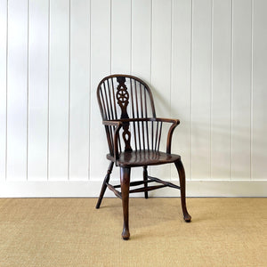 A Georgian Windsor Wheel Back Elbow Chair in Elm & Ash
