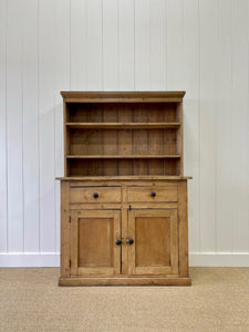 An Early 19th Century Low Pine Irish Dresser or Cupboard with Wooden Knobs