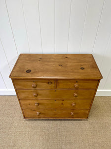 An Antique English Pine Chest of Drawers Dresser with Dark Wooden Knobs