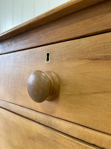 An Antique English Pine Chest of Drawers Dresser with Dark Wooden Knobs