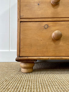 An Antique English Pine Chest of Drawers Dresser with Dark Wooden Knobs