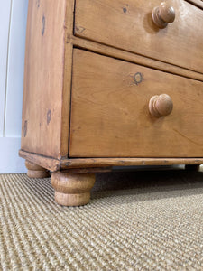 An Antique English Pine Chest of Drawers Dresser with Dark Wooden Knobs