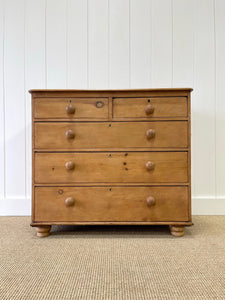 An Antique English Pine Chest of Drawers Dresser with Dark Wooden Knobs