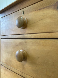 An Antique English Pine Chest of Drawers Dresser with Dark Wooden Knobs