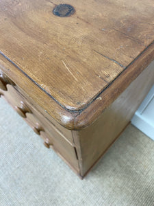 An Antique English Pine Chest of Drawers Dresser with Dark Wooden Knobs