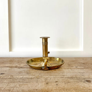 An Antique English Brass Chamber Stick
