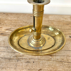 An Antique English Brass Chamber Stick