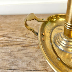 An Antique English Brass Chamber Stick