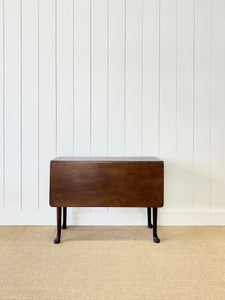 An Antique 18th Century Drop Leaf Dining Table with Pad Feet