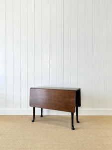 An Antique 18th Century Drop Leaf Dining Table with Pad Feet
