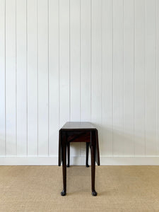 An Antique 18th Century Drop Leaf Dining Table with Pad Feet