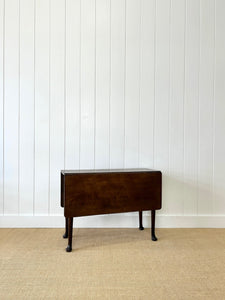 An Antique 18th Century Drop Leaf Dining Table with Pad Feet