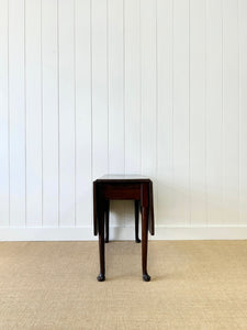 An Antique 18th Century Drop Leaf Dining Table with Pad Feet
