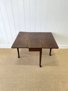 An Antique 18th Century Drop Leaf Dining Table with Pad Feet
