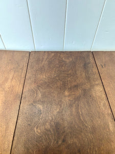 An Antique 18th Century Drop Leaf Dining Table with Pad Feet