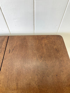 An Antique 18th Century Drop Leaf Dining Table with Pad Feet