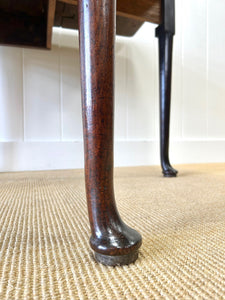 An Antique 18th Century Drop Leaf Dining Table with Pad Feet