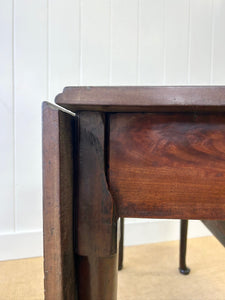 An Antique 18th Century Drop Leaf Dining Table with Pad Feet