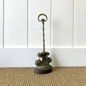 An Antique Victorian Brass Door Stop