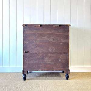 A Tall Ebonized Antique English Chest of Drawers/Dresser