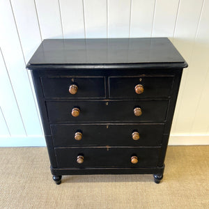 A Tall Ebonized Antique English Chest of Drawers/Dresser