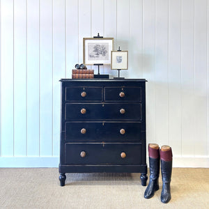 A Tall Ebonized Antique English Chest of Drawers/Dresser