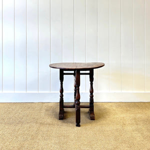An Antique English Country Oak Folding Occasional Table
