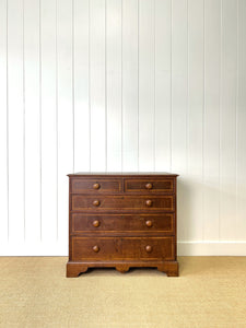 A English George III Oak Country Built Feather-banded Chest of Drawers