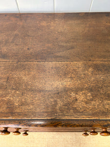 A English George III Oak Country Built Feather-banded Chest of Drawers