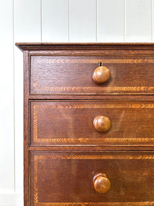 A English George III Oak Country Built Feather-banded Chest of Drawers