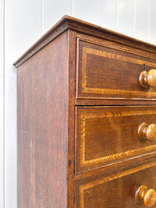 A English George III Oak Country Built Feather-banded Chest of Drawers
