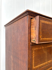A English George III Oak Country Built Feather-banded Chest of Drawers