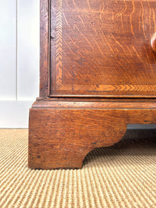 A English George III Oak Country Built Feather-banded Chest of Drawers