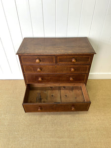 A English George III Oak Country Built Feather-banded Chest of Drawers