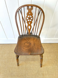 A Set of 8 Windsor Wheel Back Chairs