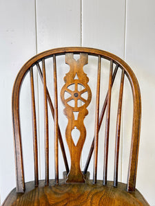 A Set of 8 Windsor Wheel Back Chairs