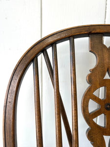 A Set of 8 Windsor Wheel Back Chairs