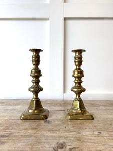 A Pair of Antique Brass Candlesticks