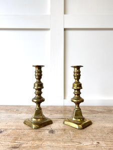A Pair of Antique Brass Candlesticks