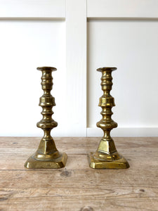 A Pair of Antique Brass Candlesticks