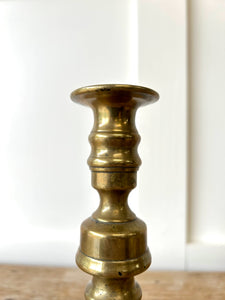 A Pair of Antique Brass Candlesticks