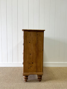An Antique English Pine Chest of Drawers Dresser with Dark Wooden Knobs