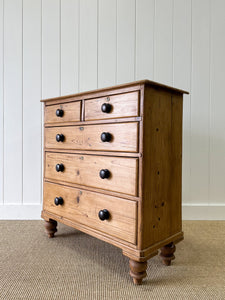 An Antique English Pine Chest of Drawers Dresser with Dark Wooden Knobs