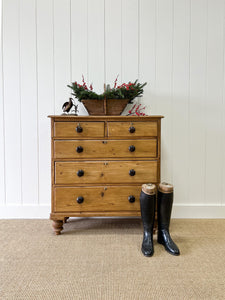 An Antique English Pine Chest of Drawers Dresser with Dark Wooden Knobs