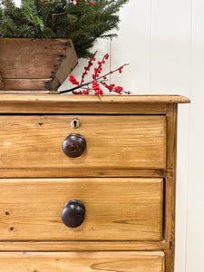 An Antique English Pine Chest of Drawers Dresser with Dark Wooden Knobs